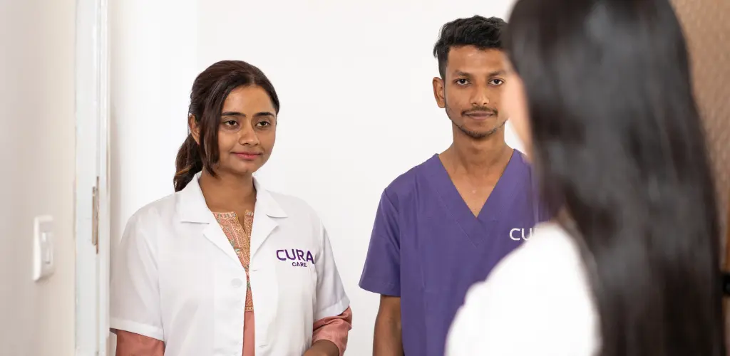 Dentist and dental assistant at doorstep